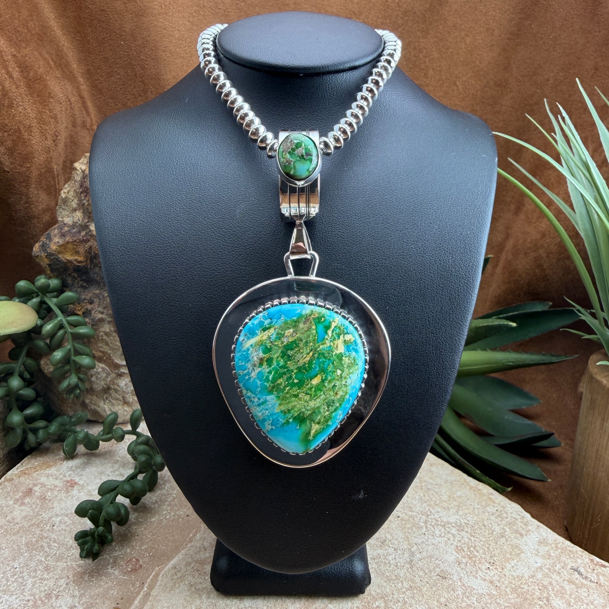 Necklace with green and blue stoned pendant 