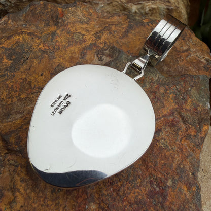 Back of pendant with stamped LEONARD NEZ , STERLING, and NAVAJO