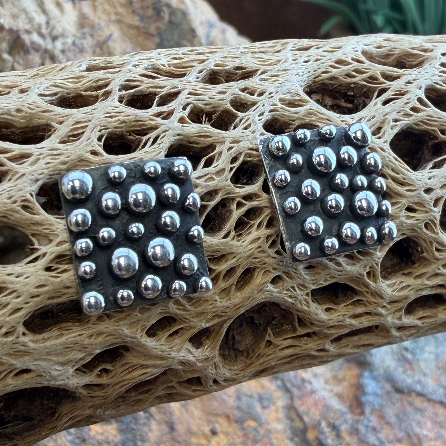 Million Drops Sterling Silver Square Post Earrings by Ray Coriz - angled view showing dimensional hand-soldered silver spheres