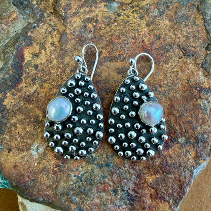 Million Drops Fresh Water Pearl Sterling Silver Earrings by Ray Coriz - angled view showing dimensional hand-soldered silver spheres and pearl cabochon