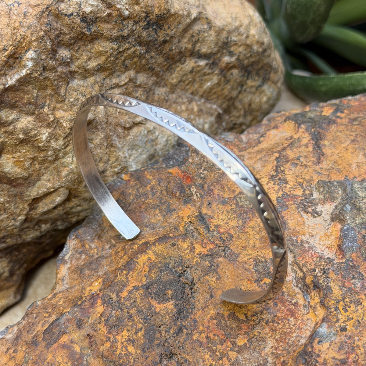 Angled view of Verna Tahe knife-edge cuff bracelet