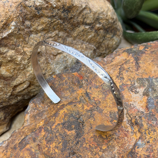 Angled view of Verna Tahe knife-edge cuff bracelet