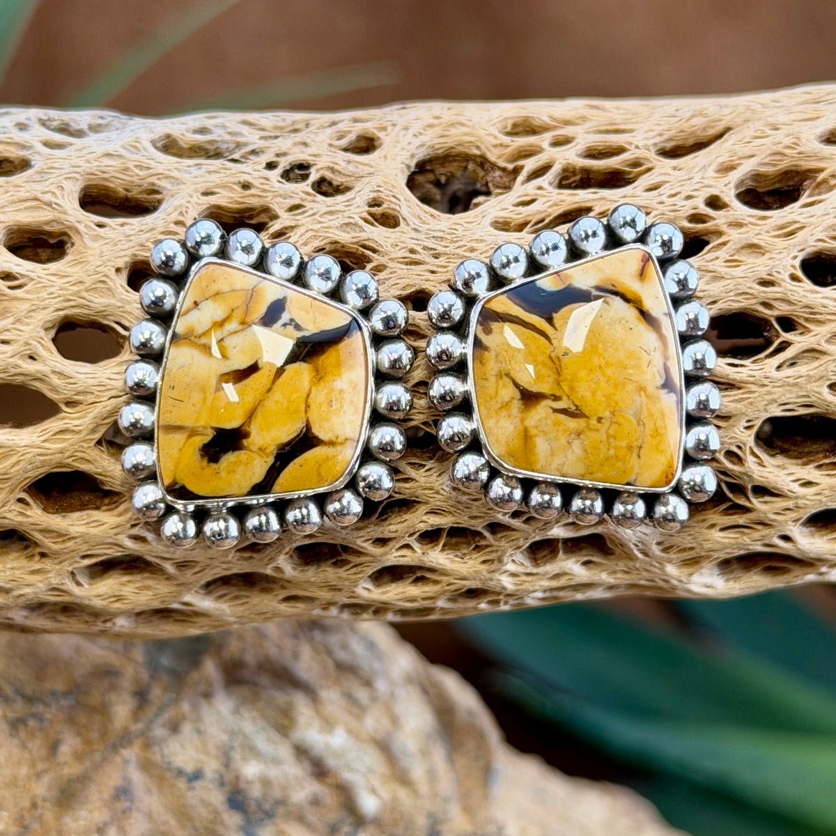 Peanut Wood Post Earrings by Artie Yellowhorse, angled view