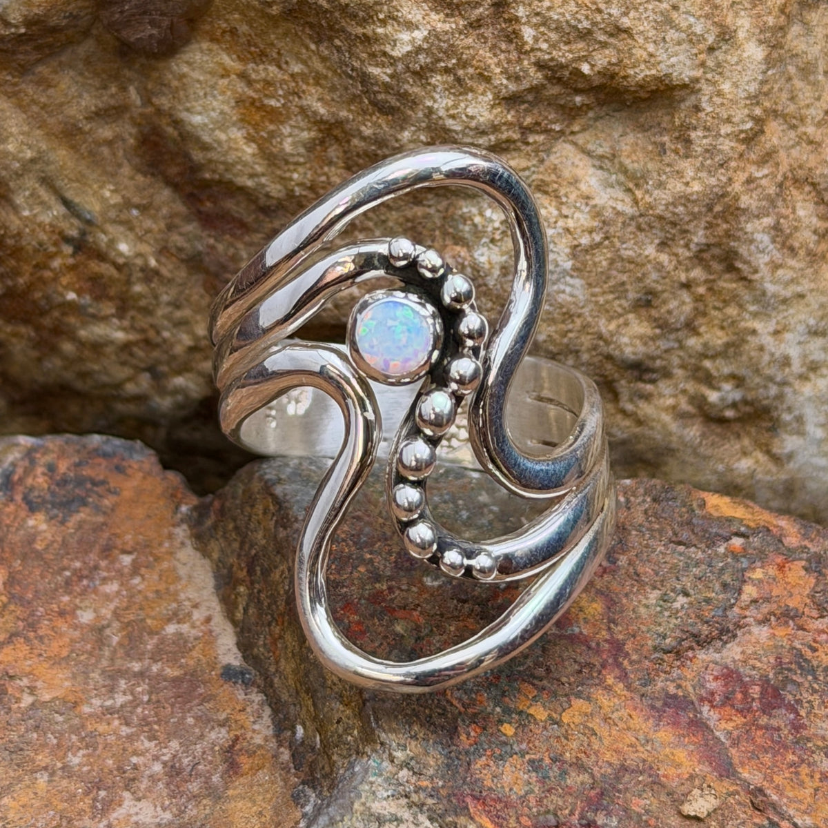 Ray Coriz opal sterling silver wave ring, angled front view