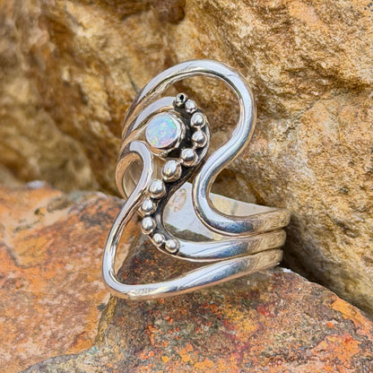Side view of size 9 opal sterling silver wave ring by Ray Coriz
