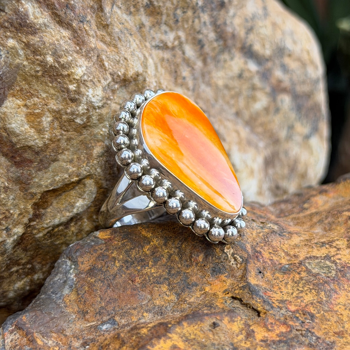 Orange Spiny Oyster Oblong Sterling Silver Ring by Artie Yellowhorse, angled view