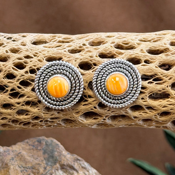 Orange Spiny Oyster round post earrings with twisted-rope borders, front view