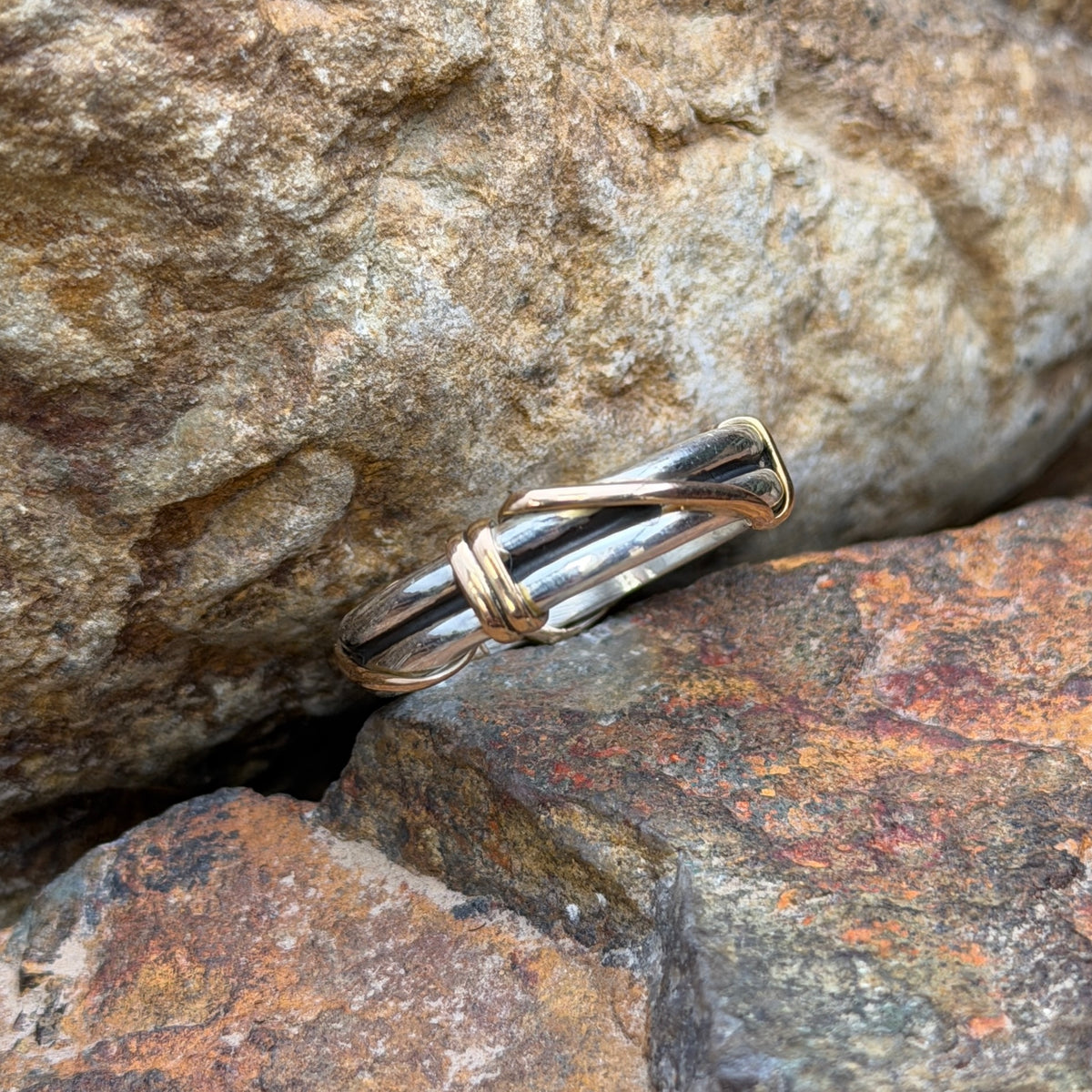 Sterling silver double-band ring with gold-tone wrapped accents, front view