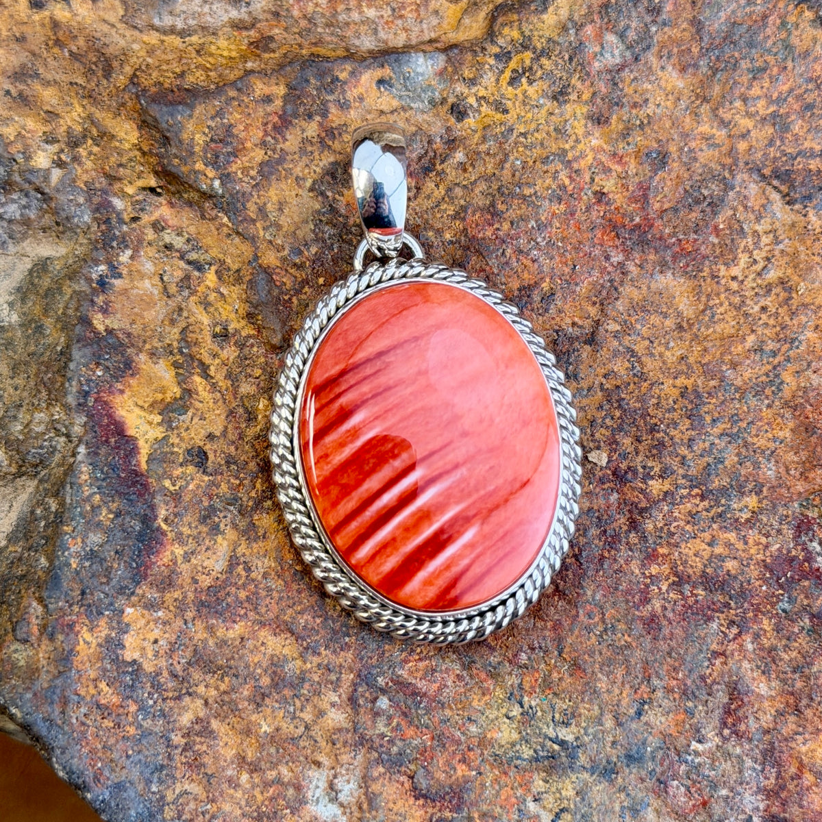 Red Spiny Oyster Sterling Pendant by Artie Yellowhorse, close up
