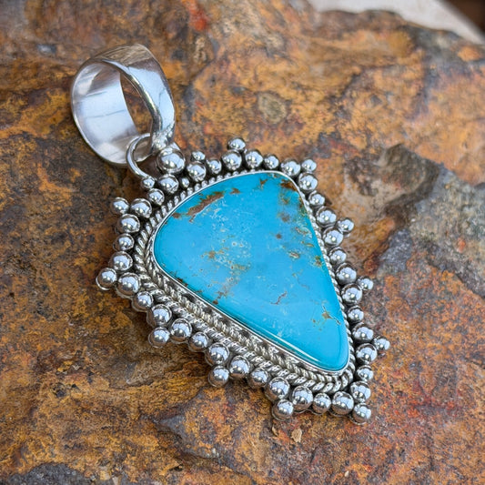 Front of large Royston turquoise sterling silver pendant with bead border