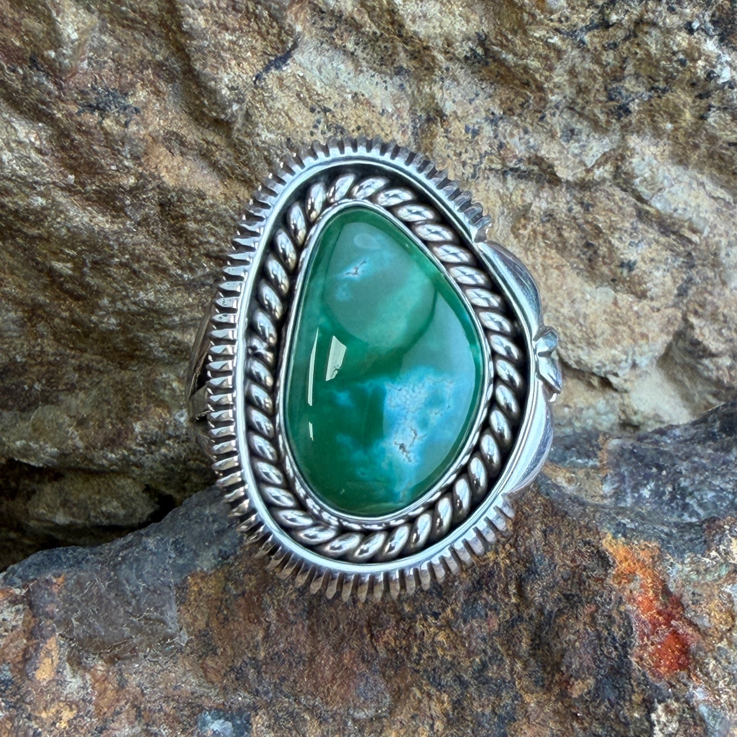 Royston Turquoise Ring by Artie Yellowhorse - top view showing teardrop green cabochon with rope and serrated silver border