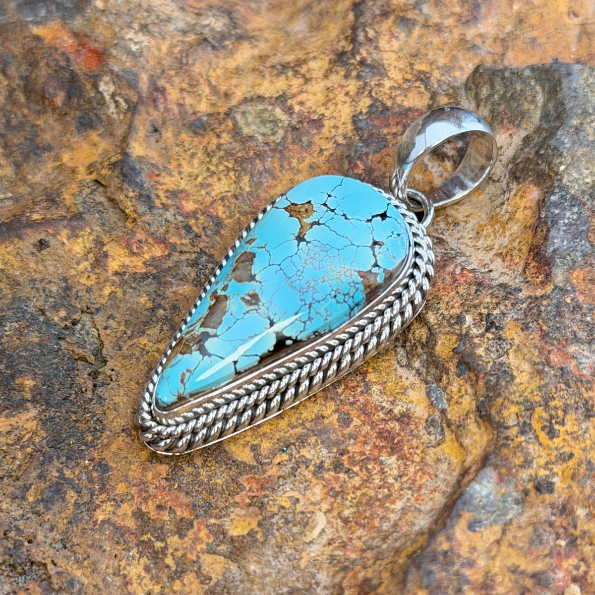 Side view of Royston turquoise sterling silver pendant