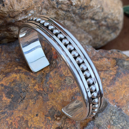 Artie Yellowhorse sterling silver cuff with centered bead row and polished borders