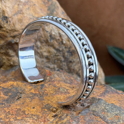 Side view of Artie Yellowhorse sterling silver bead row cuff