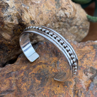 Close-up of centered silver beads and recessed channel on Artie Yellowhorse cuff