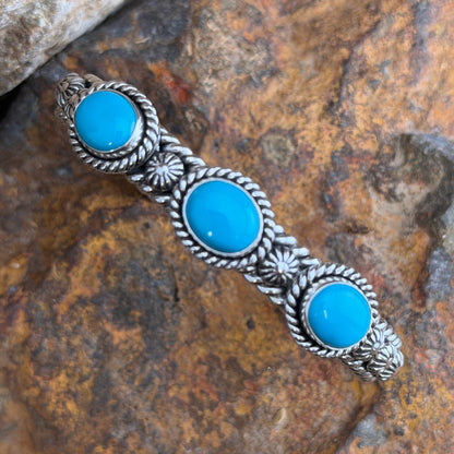 Artie Yellowhorse Sleeping Beauty turquoise three-stone cuff bracelet angled view