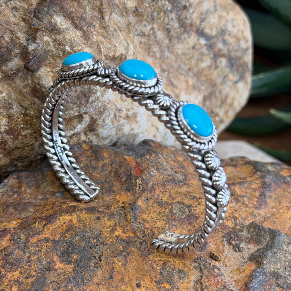 Front of Sleeping Beauty turquoise sterling silver cuff with three cabochons