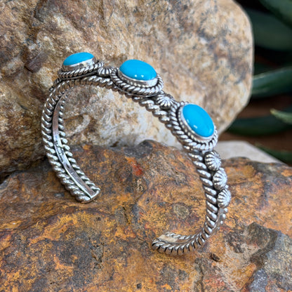 Front of Sleeping Beauty turquoise sterling silver cuff with three cabochons