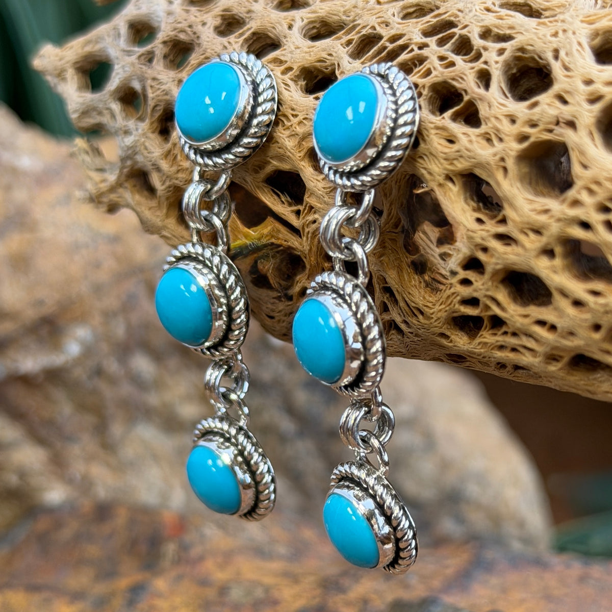 Back of triple-drop post earrings showing Artie Yellowhorse and Sterling stamps