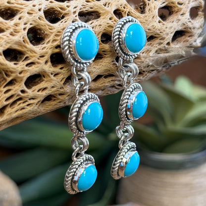 Side view of Artie Yellowhorse turquoise post dangle earrings