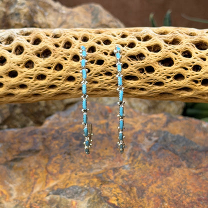 A. Hughte slender turquoise hoop earrings, front view