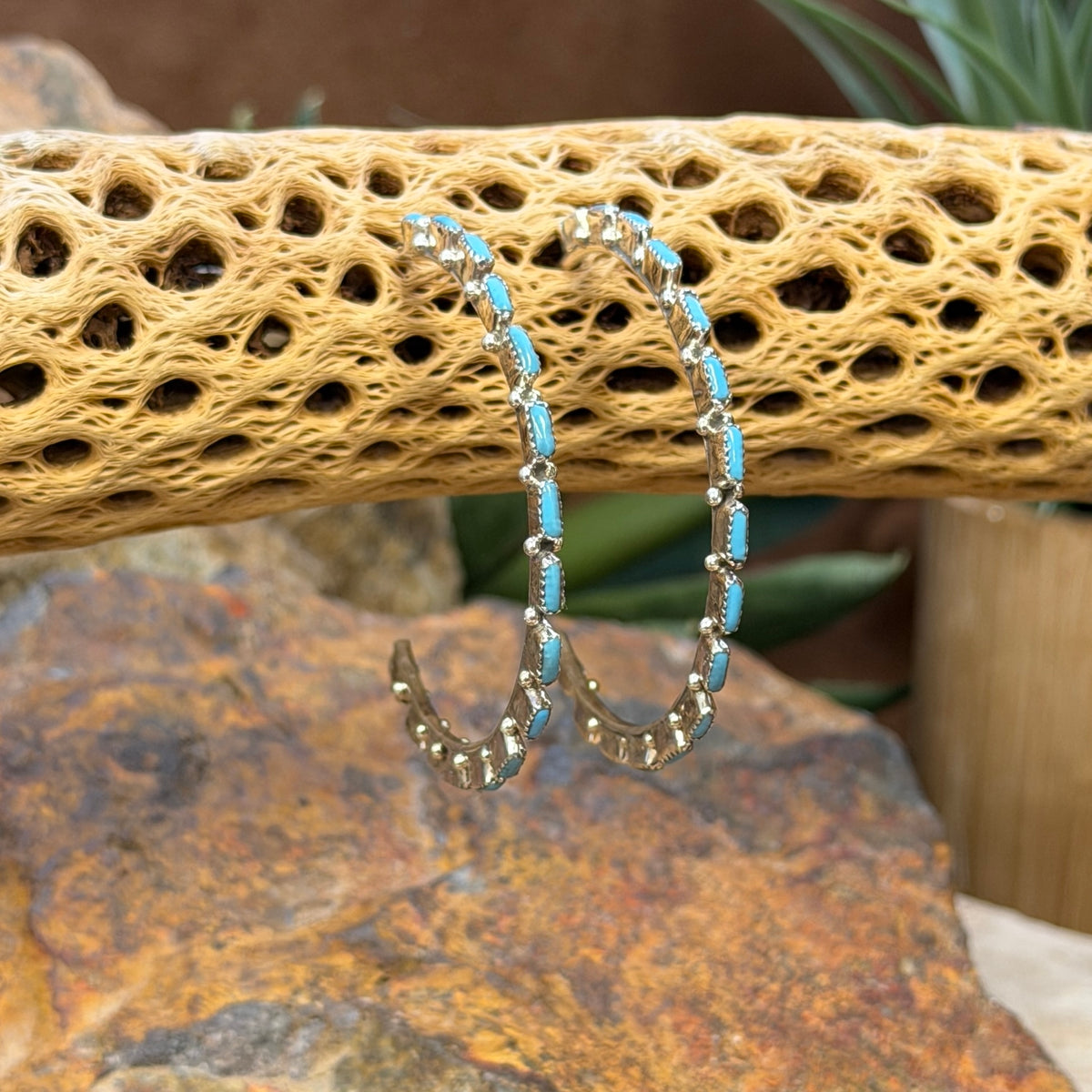 A. Hughte turquoise cabochon hoop earrings, angled view