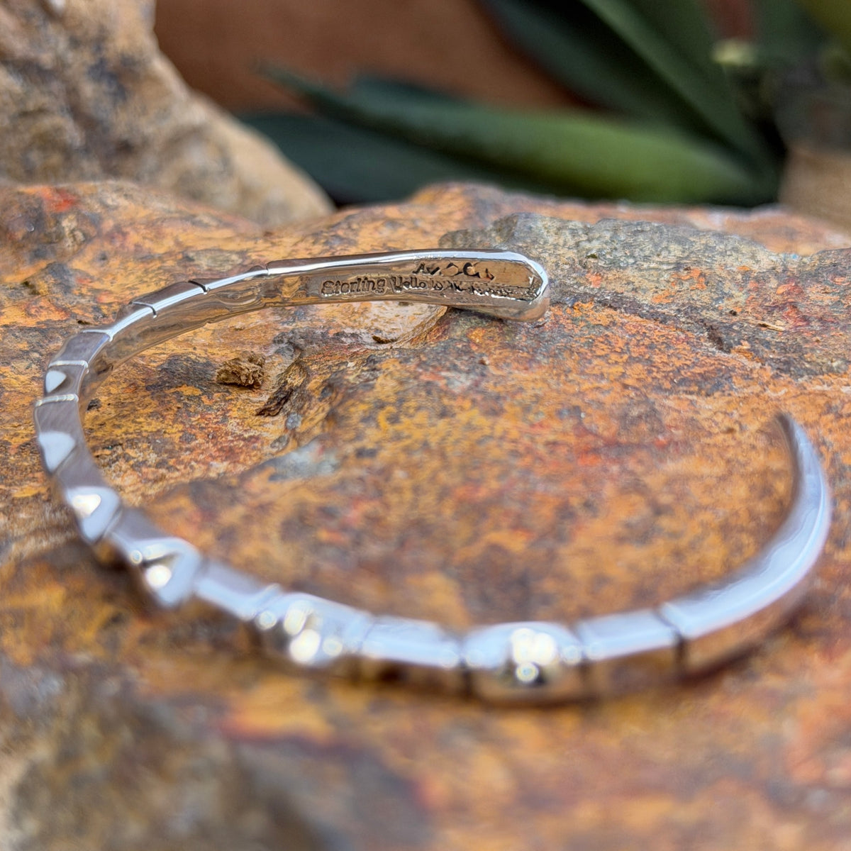 geometric patterned cuff by artie yellowhorse. this picture showcases the stamping,