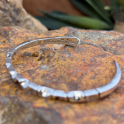 geometric patterned cuff by artie yellowhorse. this picture showcases the stamping,