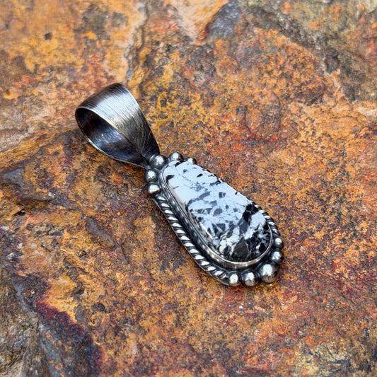 Angled White Buffalo pendant with brushed silver bale