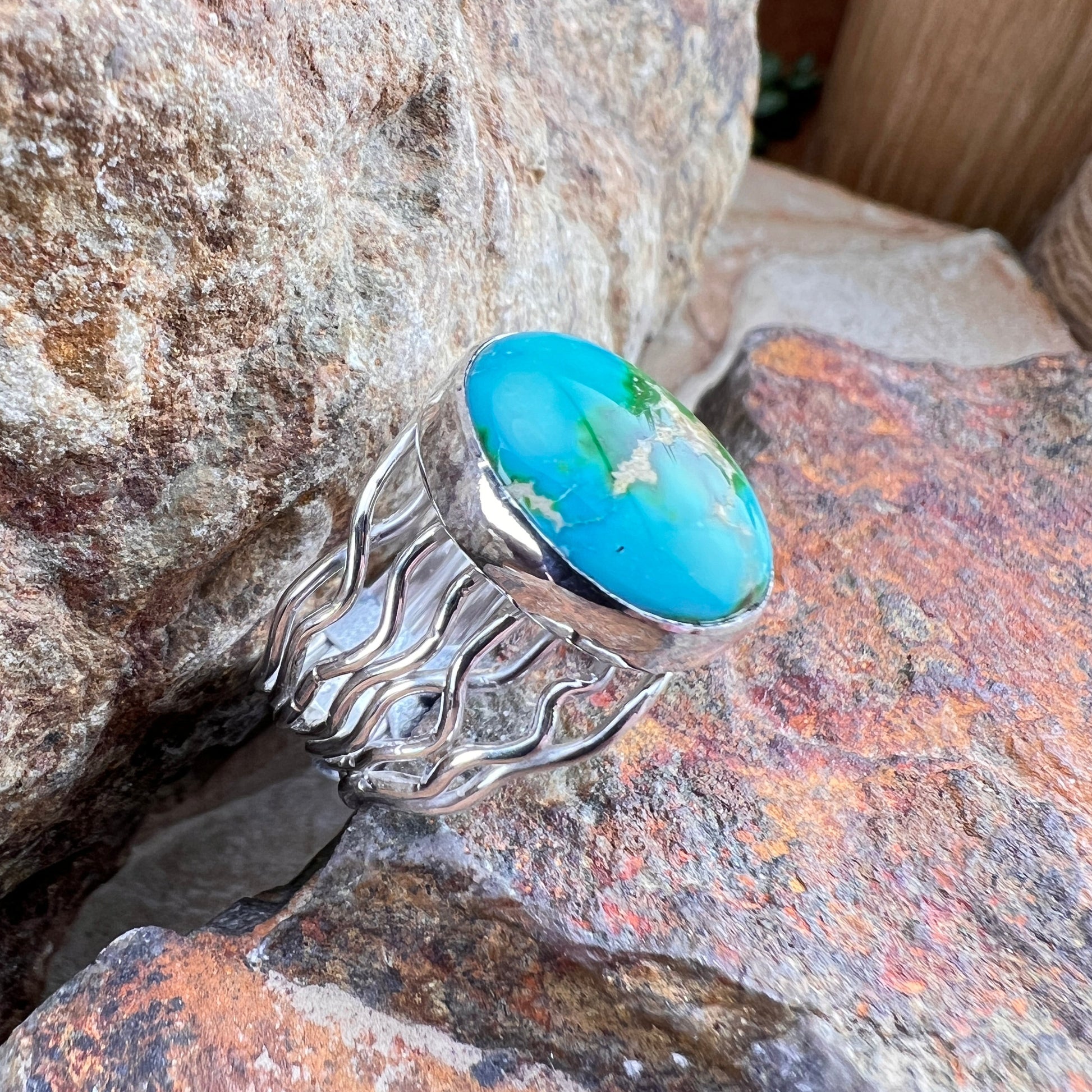 Turquoise ring on a stone surface