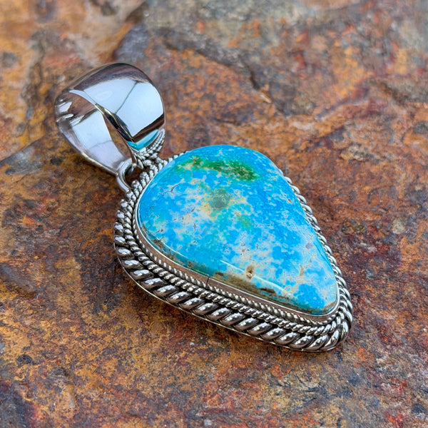 Back of Artie Yellowhorse Sonoran Gold turquoise pendant showing Sterling stamp