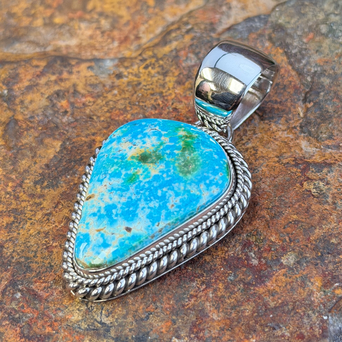 angled view of Artie Yellowhorse Sonoran Gold turquoise pendant