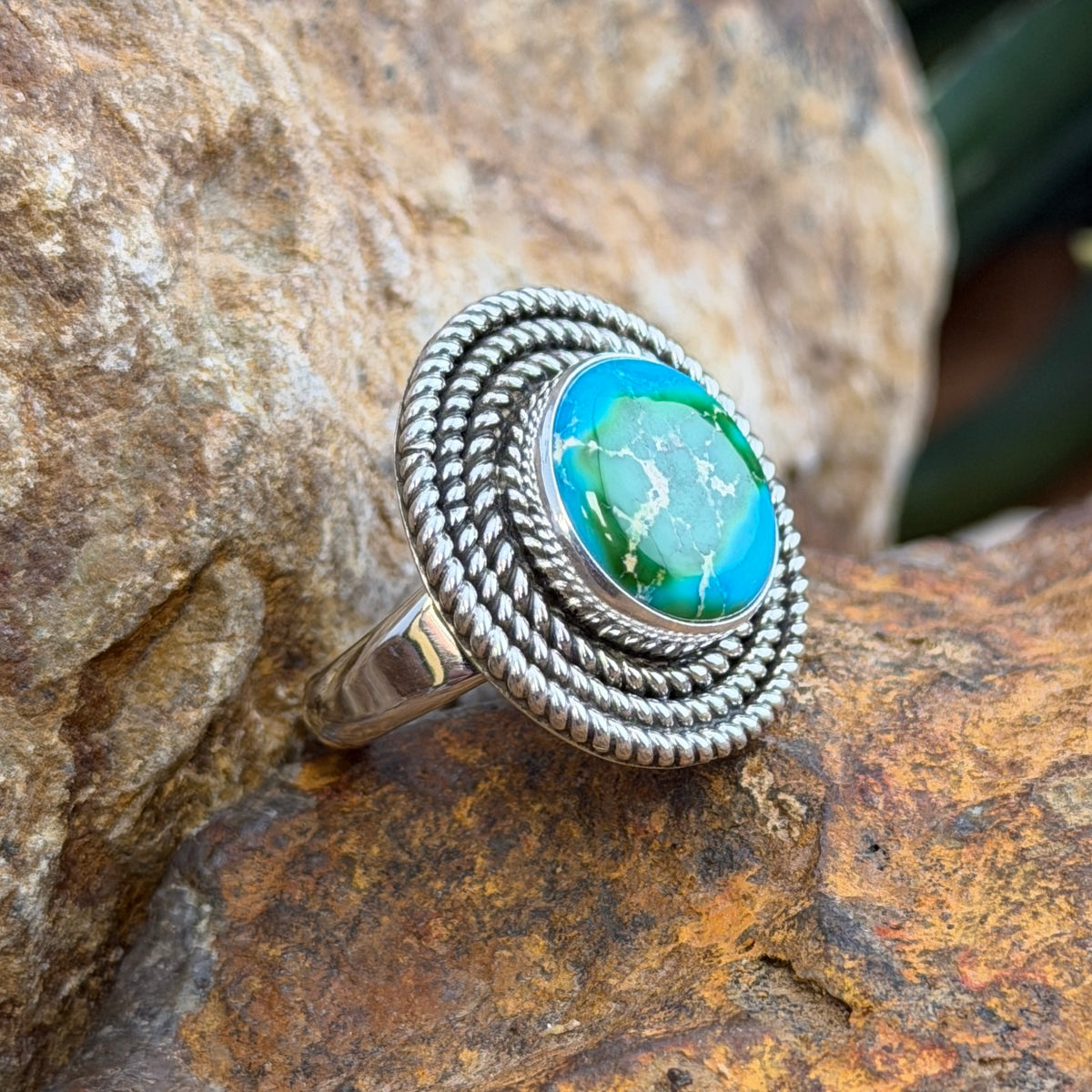 side view of Artie Yellowhorse ring showing hallmark and silver band