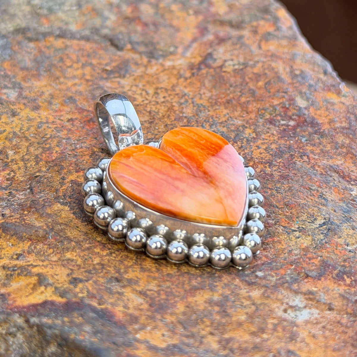 Small Spiny Oyster Heart Sterling Pendant by Artie Yellowhorse, hallmark stamp