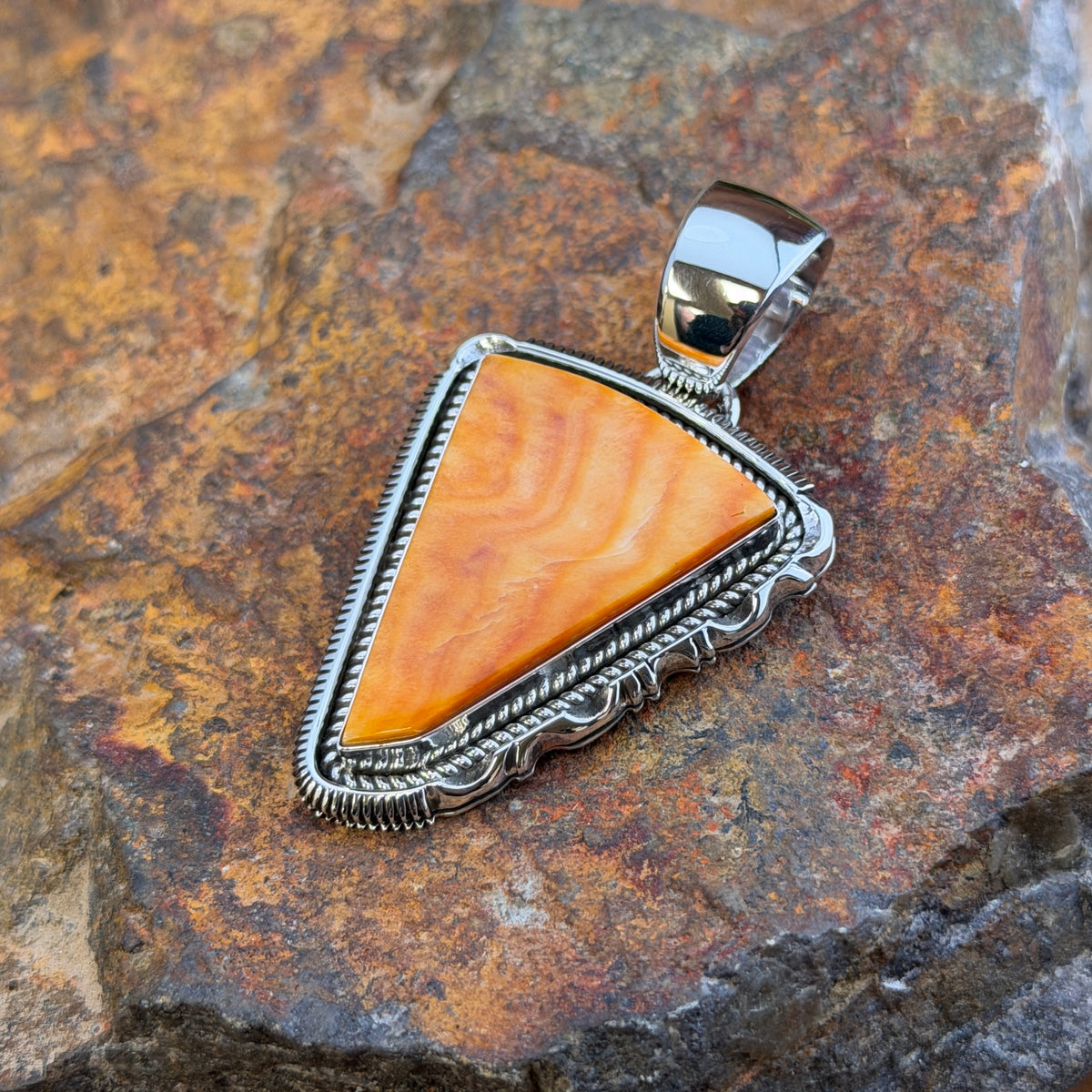 Spiny Oyster Sterling Pendant by Henry Chackee, angled view