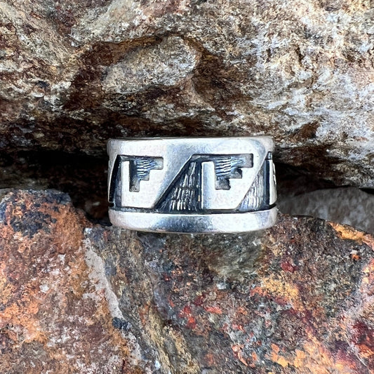 Overlayed Sterling Silver ring. Geometric Eagle--like shapes repeat themselves around the band; they are oxidized and textured. 