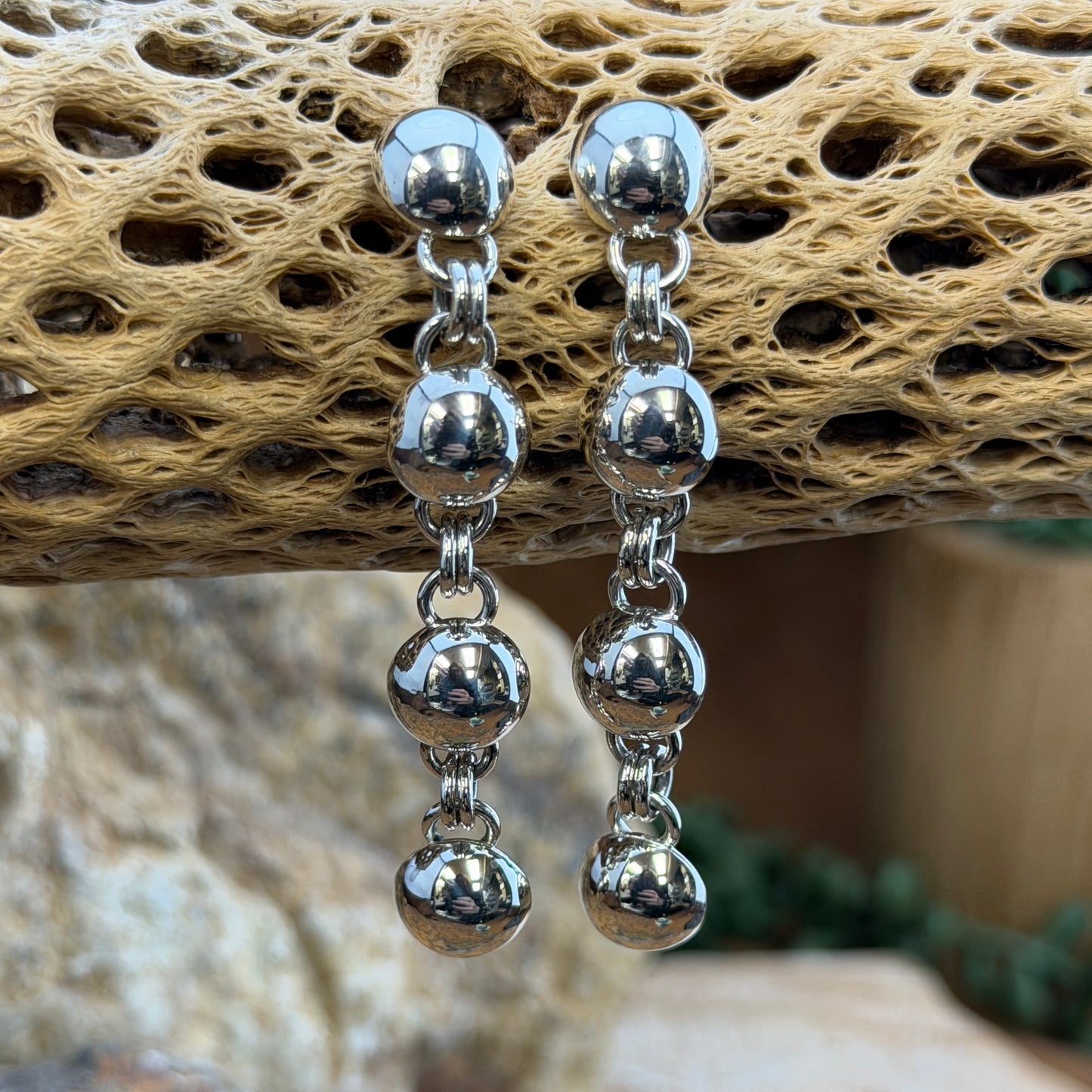 Sterling Silver Sphere and Byzantine Chain Dangle Earrings by Artie Yellowhorse - styled on cholla cactus showing full drop length and movement