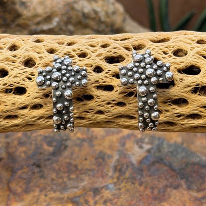 A. Douglas silver crosses with raised beadwork