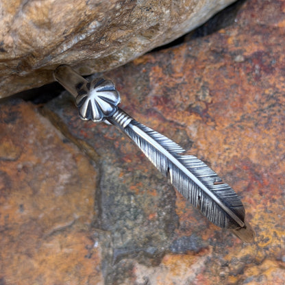 Ray Coriz sterling silver cuff bracelet with detailed feather and floral concho, front view