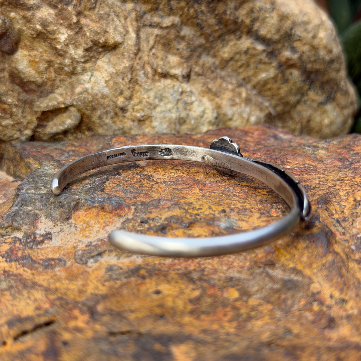 Inside of Ray Coriz cuff bracelet showing sterling silver and Coriz hallmarks