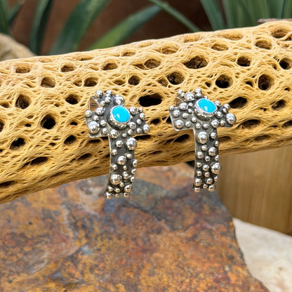 Silver beadwork and round turquoise cabochons on A. Douglas crosses