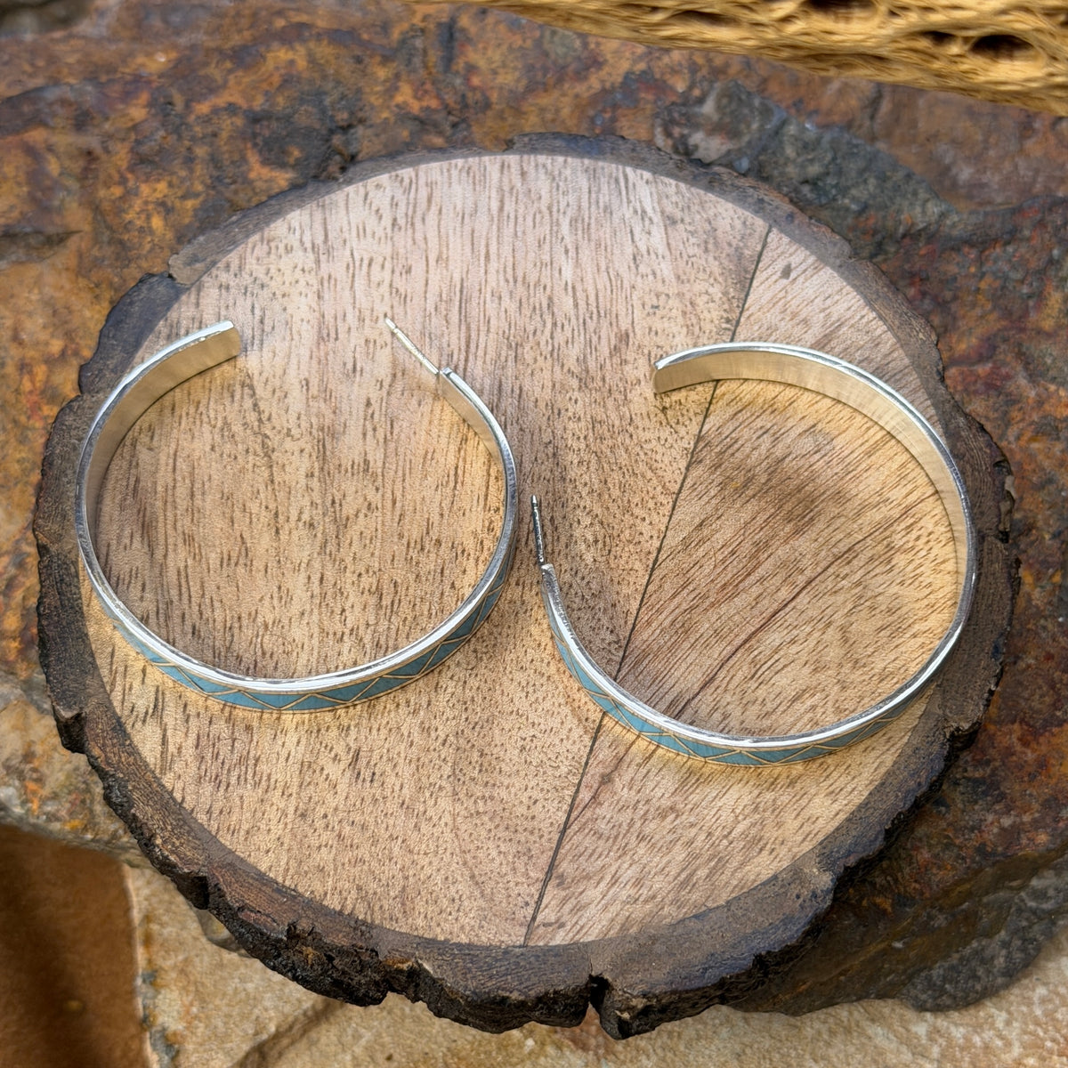 Hoop earrings inlayed in a zig zag pattern with turquoise by tina gasper