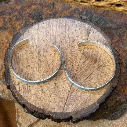 Hoop earrings inlayed in a zig zag pattern with turquoise by tina gasper
