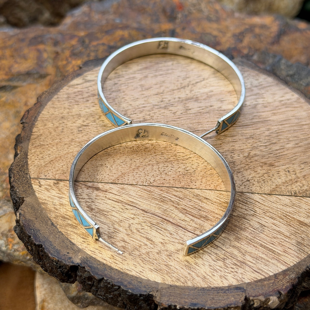 Hoop earrings inlayed in a zig zag pattern with turquoise by tina gasper