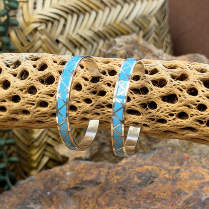 Hoop earrings inlayed in a zig zag pattern with turquoise by tina gasper