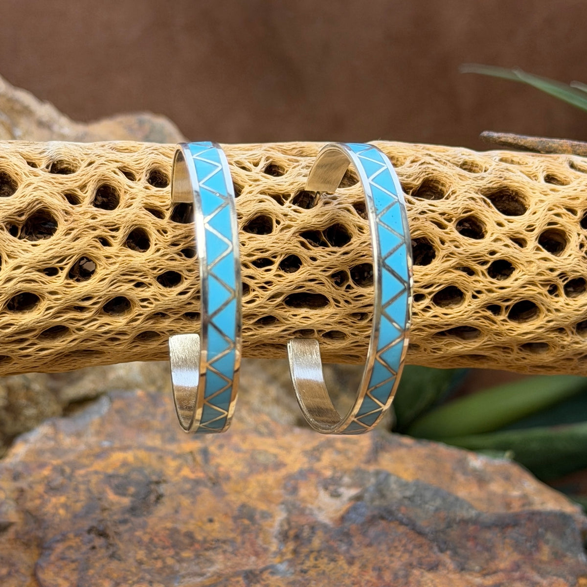 Hoop earrings inlayed in a zig zag pattern with turquoise by tina gasper