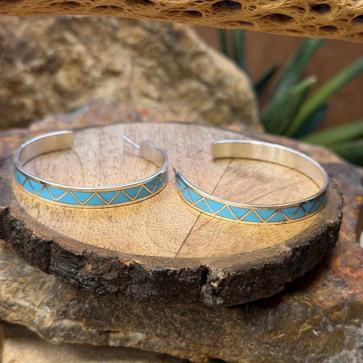 Hoop earrings inlayed in a zig zag pattern with turquoise by tina gasper