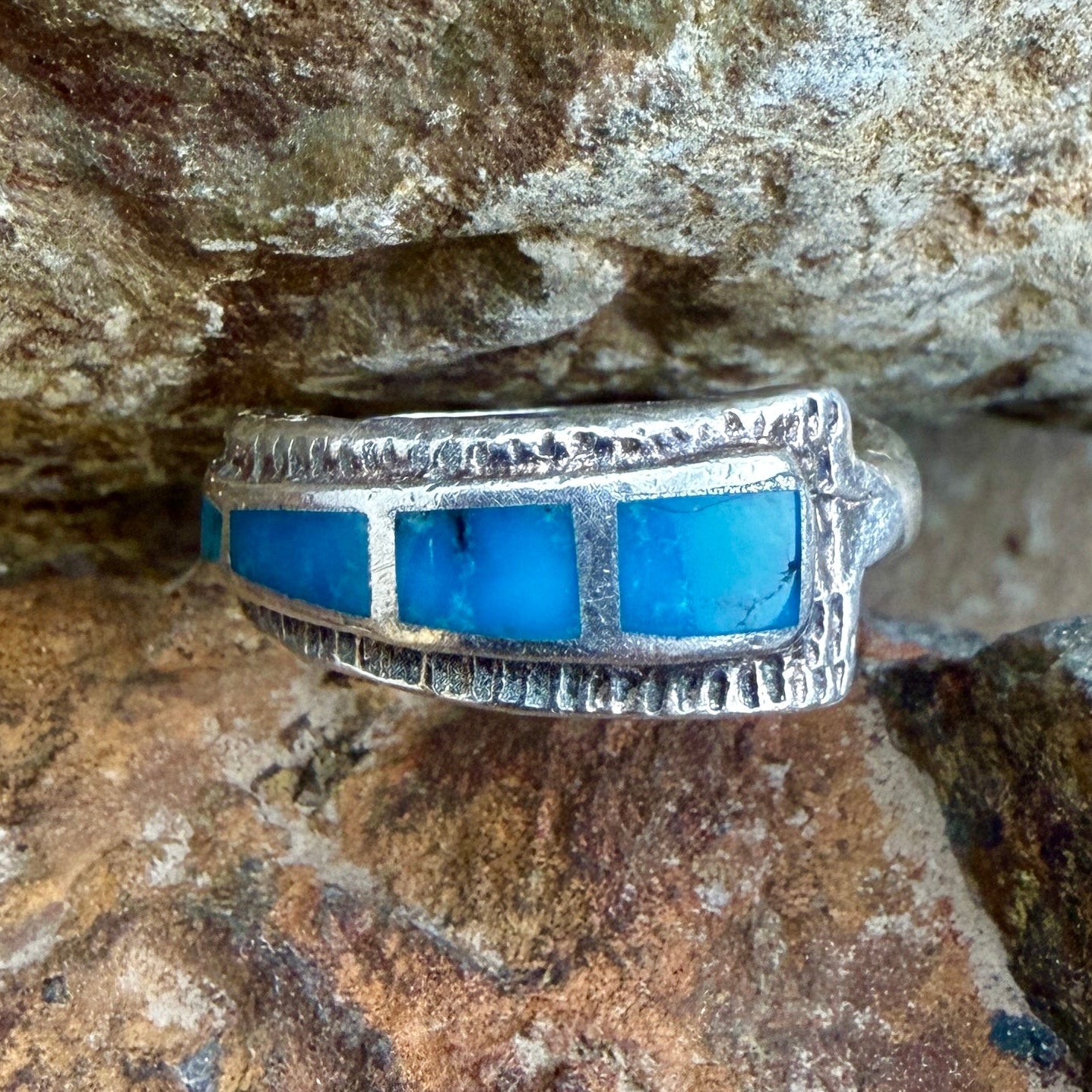 Birds eye view of a ring with rectangular turquoise inlay
