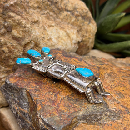 Angled view of vintage blue turquoise kachina bolo slide and pendant