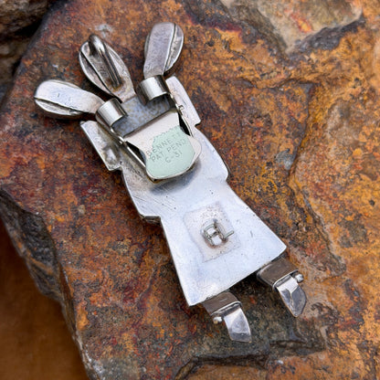Back of kachina bolo slide and pendant showing bolo clasp and engraved FL initials